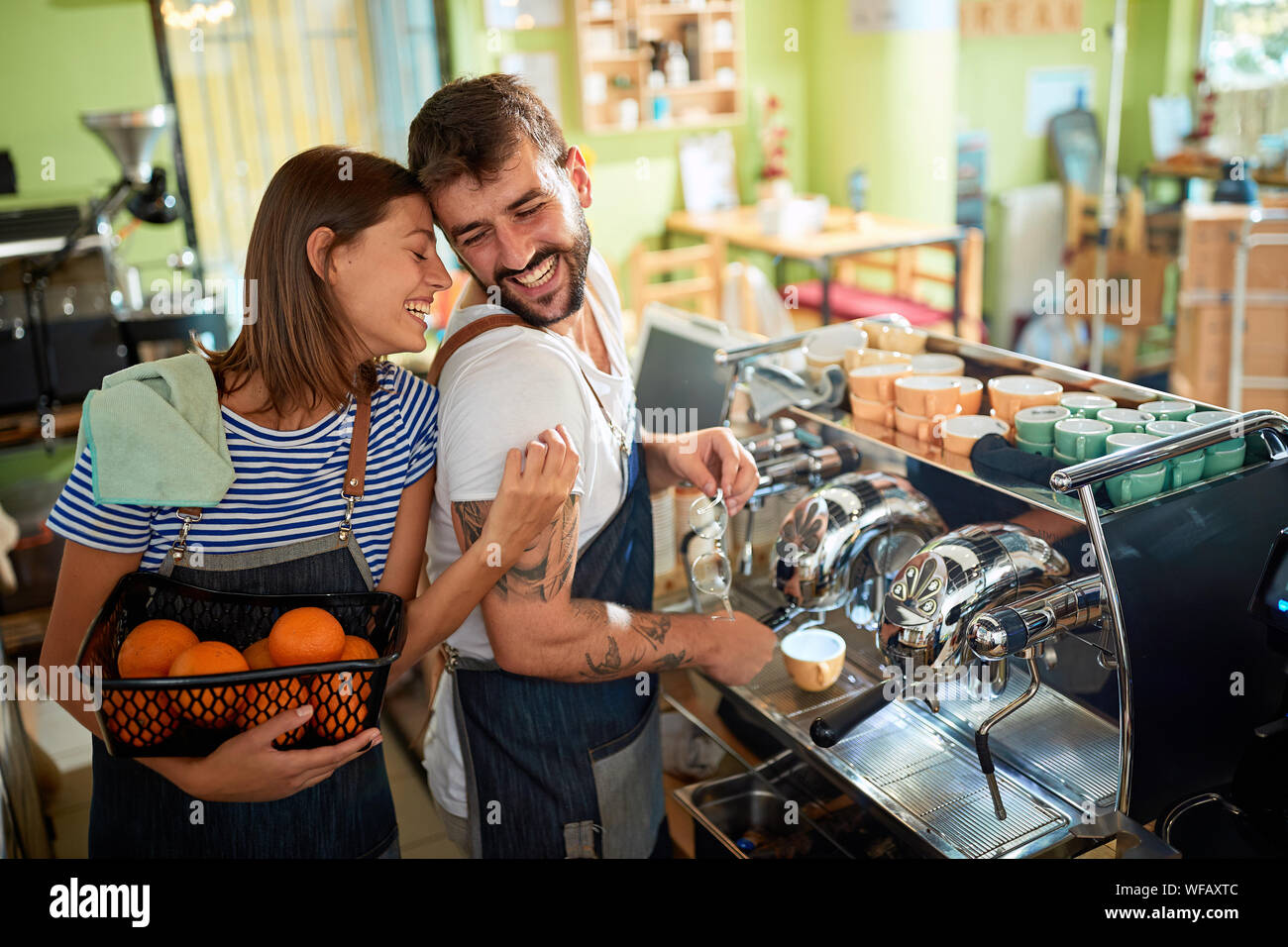 Smiling couple barista owner working at coffee shop Stock Photo