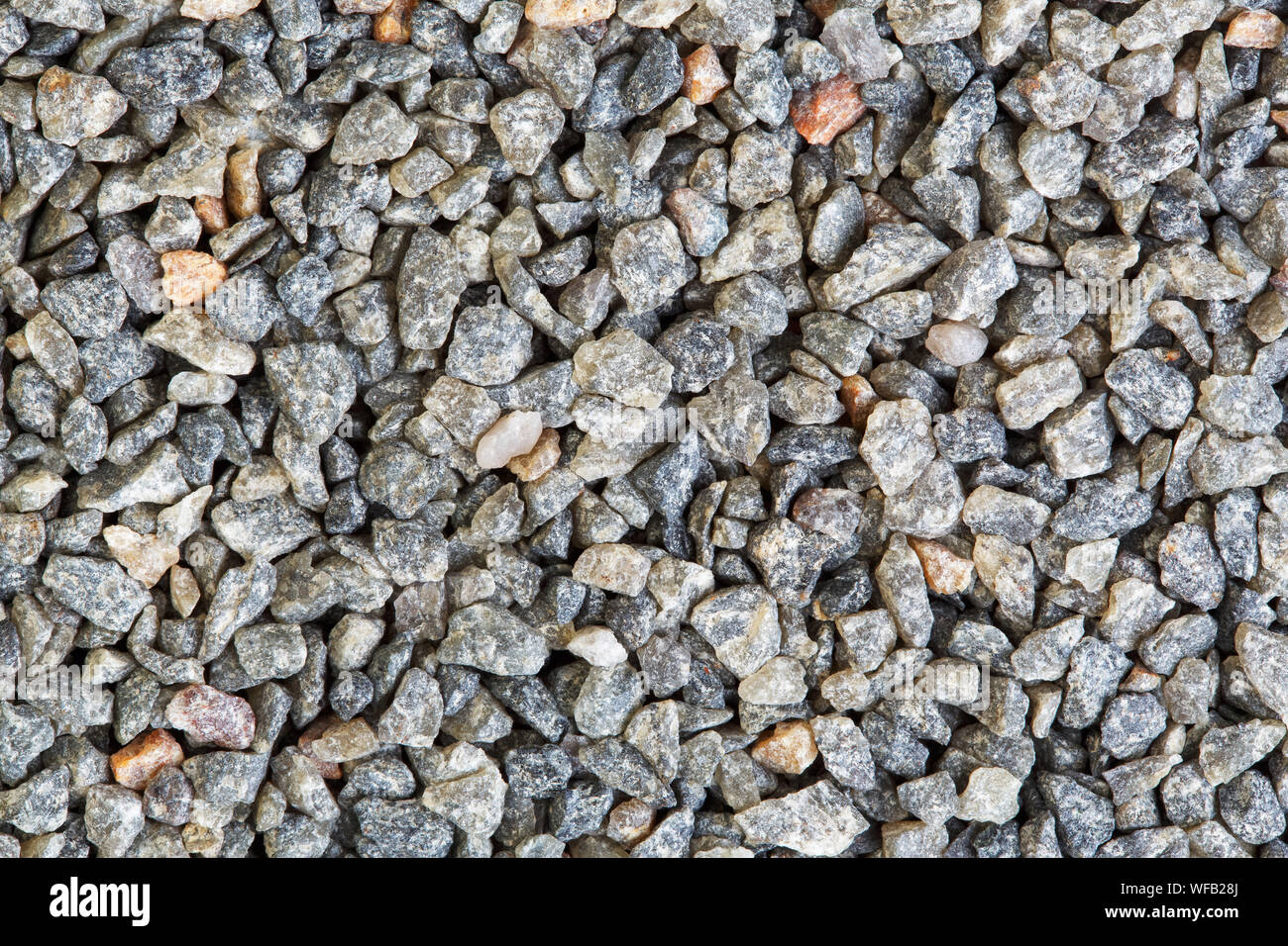 Colorful gravel background texture. Close-up shot of quartz stones on macro. Stock Photo