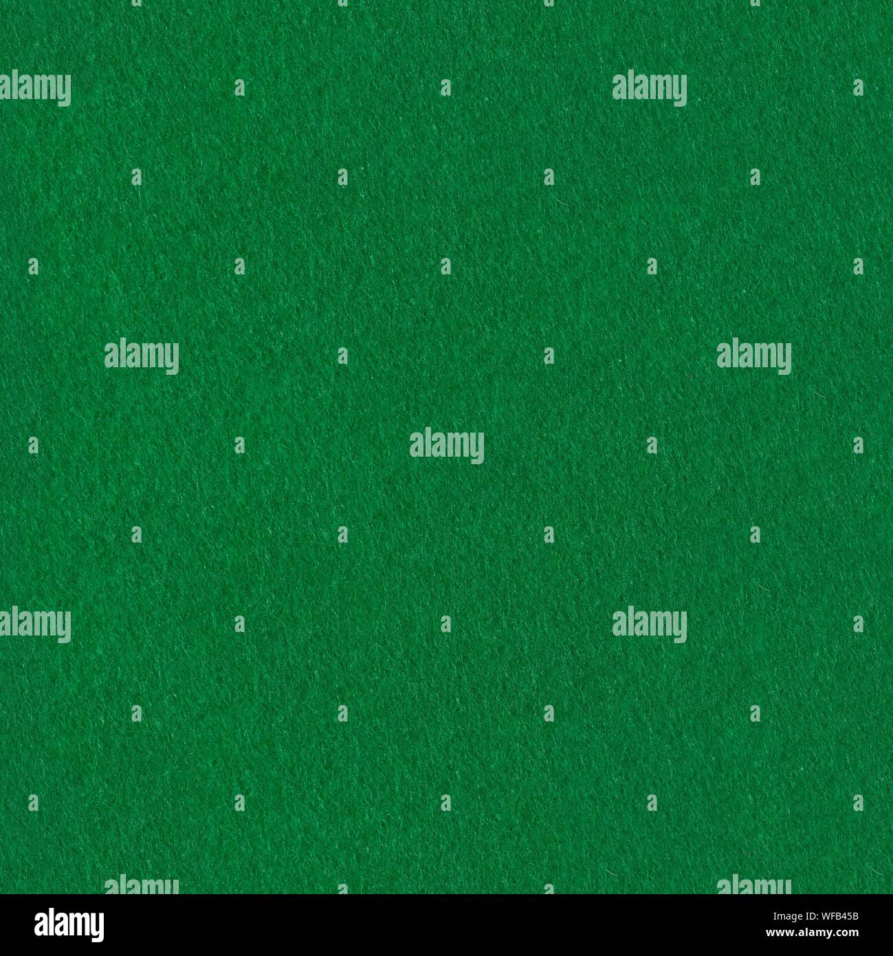 Green felt fabric for background. Seamless square texture, tile ready. Stock Photo