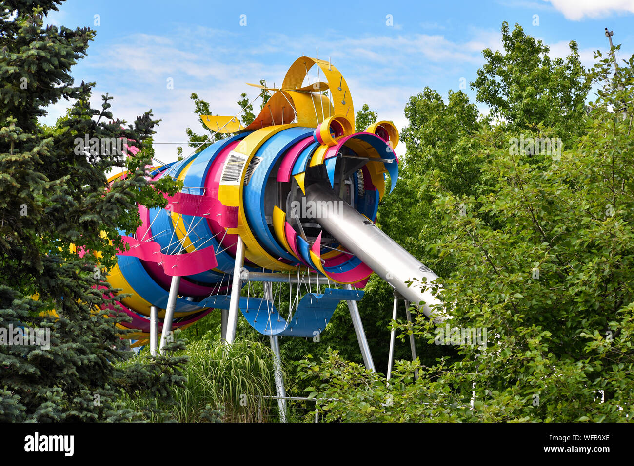 PARIS, FRANCE - JULY 16, 2016: The garden of Dragon is a free play area for children in Parc de la Villette. The colorful Dragon slide, made of steel, Stock Photo