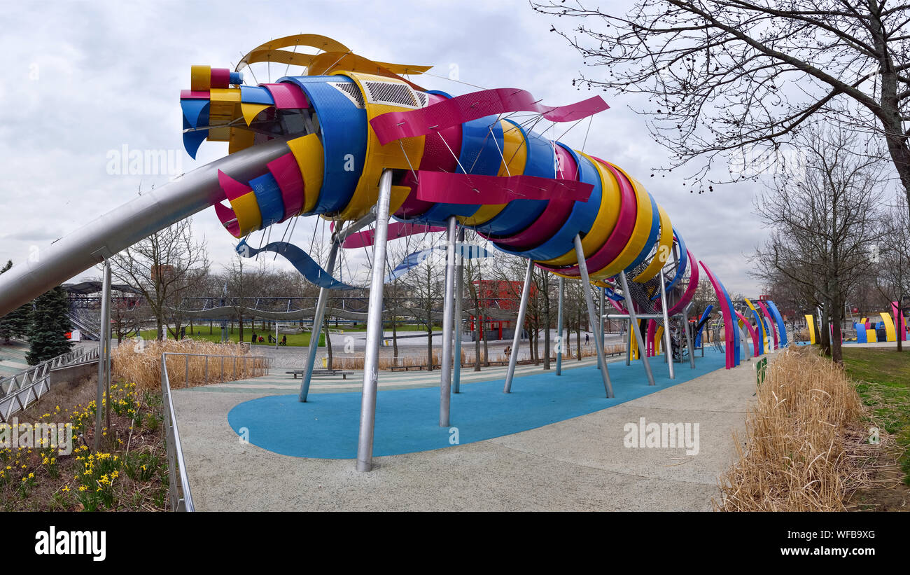 PARIS, FRANCE - MARCH 10, 2016: The garden of Dragon is a free play area for children in Parc de la Villette. The colorful Dragon slide, made of steel Stock Photo