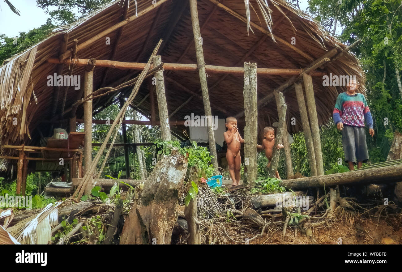 Portrait of a family of a fisherman living in a hut on the shore of a tropical river. Stock Photo