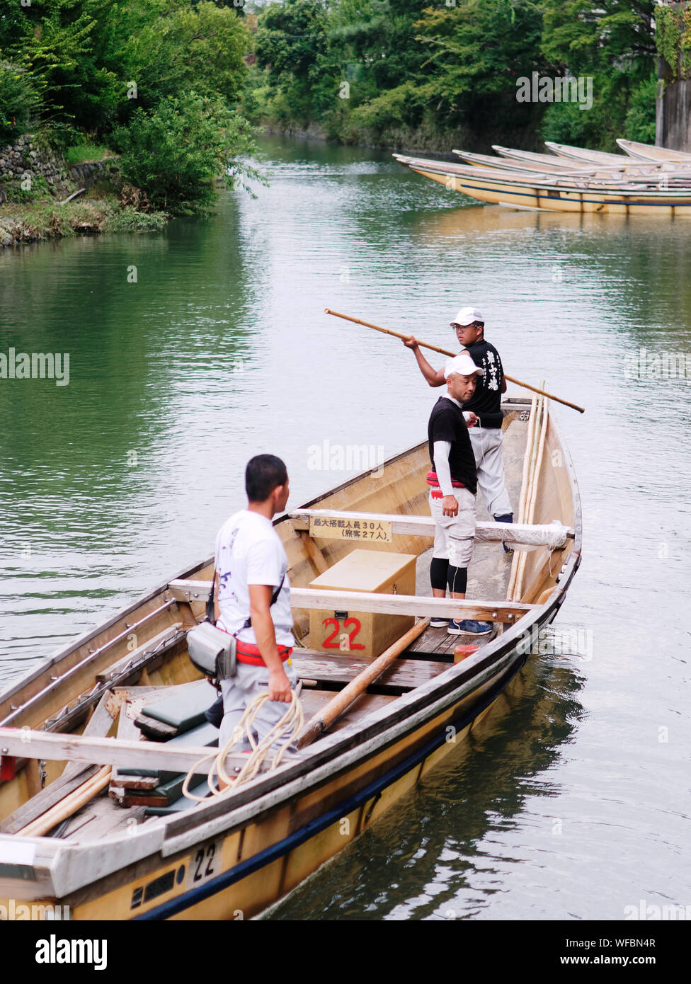 Arashiyama, Kyoto / Japan AUG 21 2019 Boatmen rowing the boat