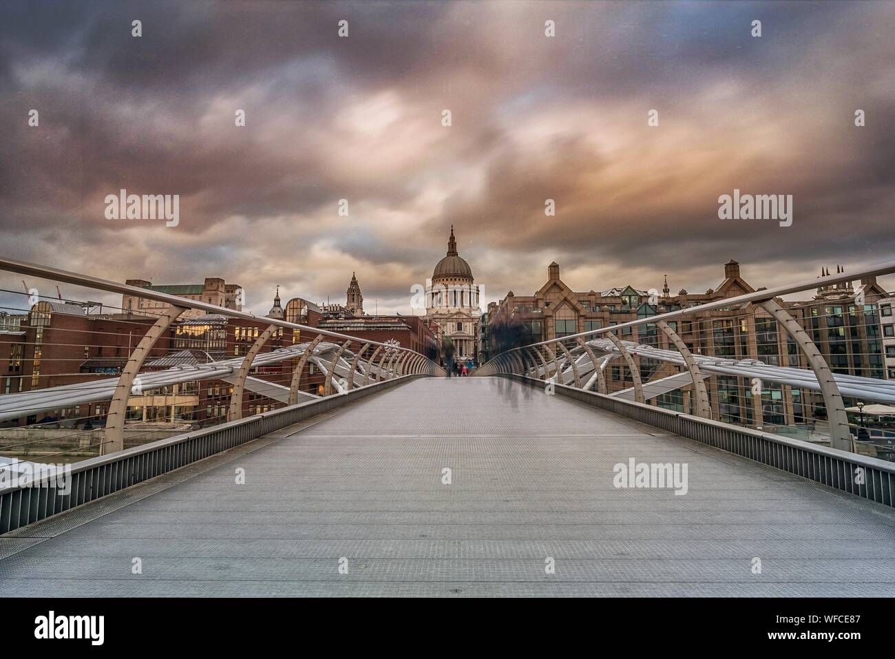 Millennium Bridge Against St Pauls Cathedral During Sunset Stock Photo