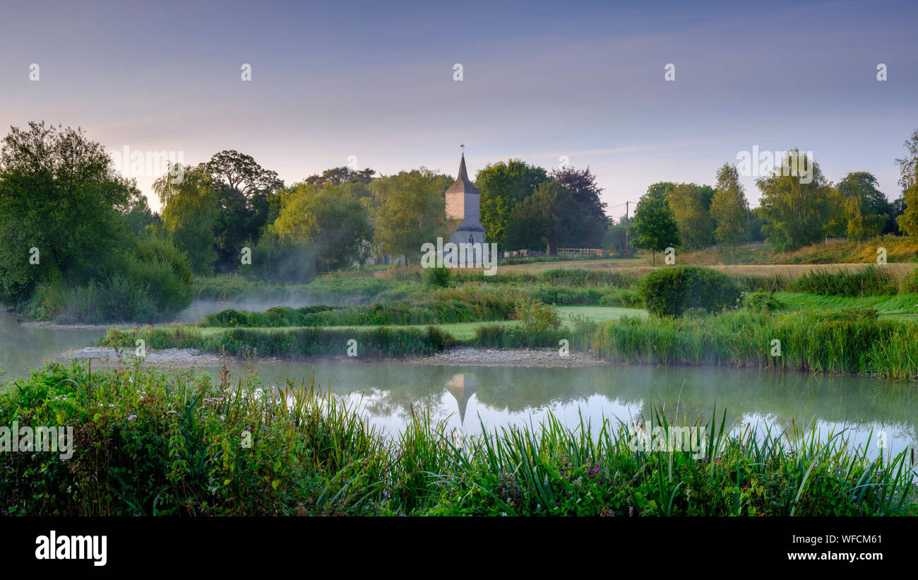 Stoke Charity, UK Aug 21, 2019 Dawn light and mist on the old mill