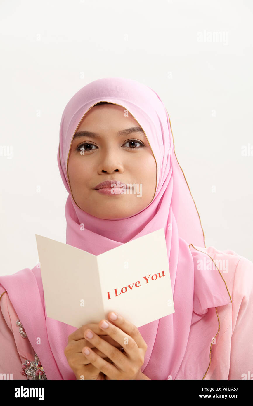 malay woman with tudung holding i love you greeting card Stock Photo