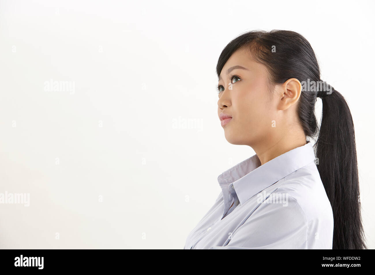 side view of the asian woman on the white background Stock Photo