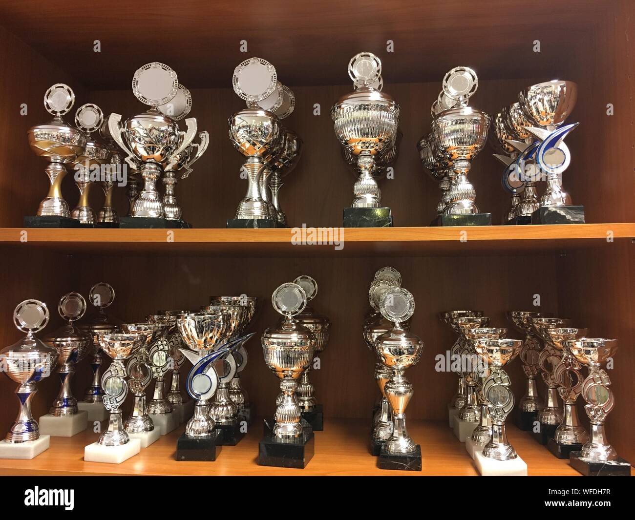 Full Frame Shot Of Trophies On Shelves Stock Photo