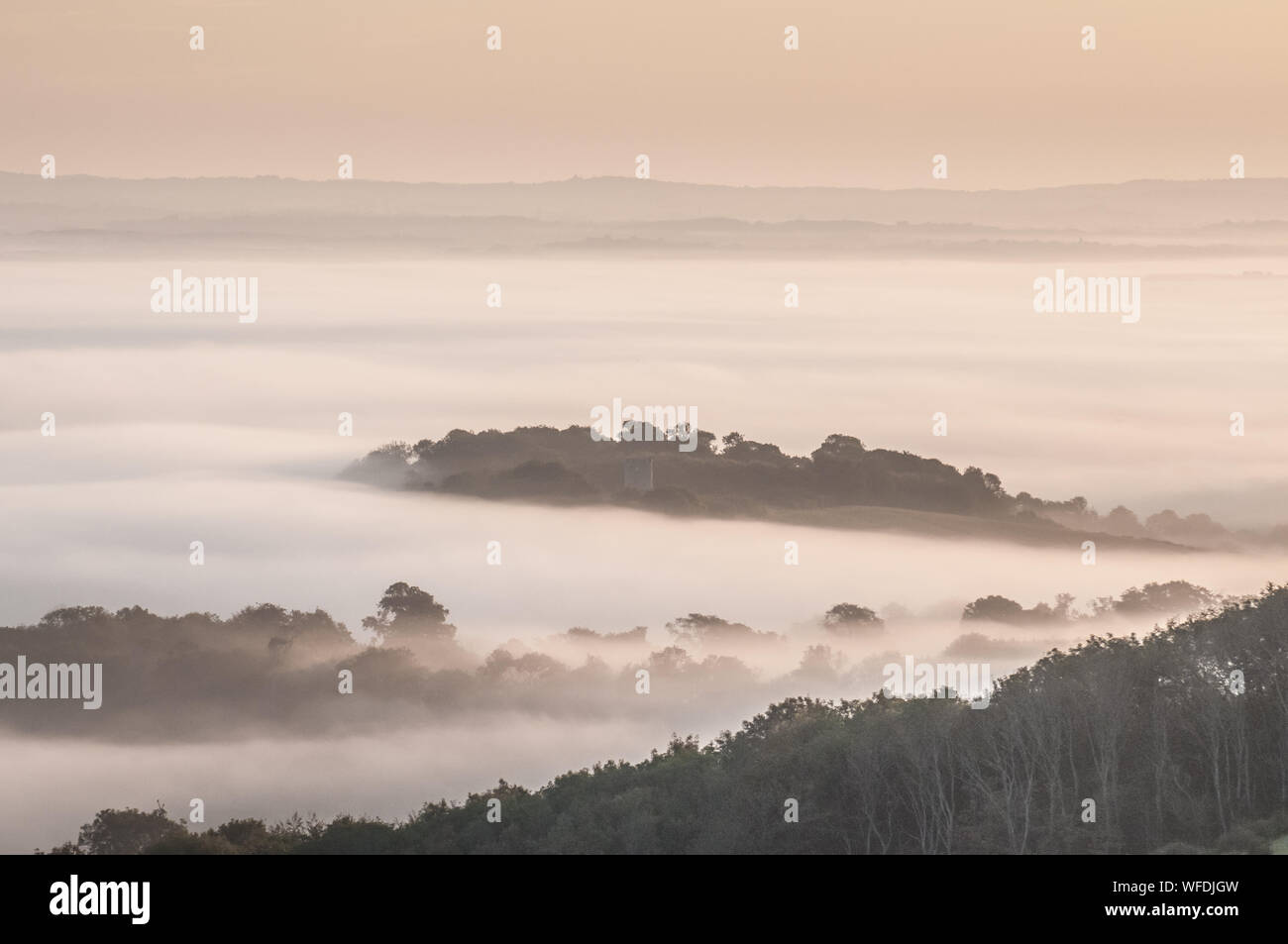 Firle, Lewes, East Sussex, UK..31st August 2019..Tranquil ethereal scene as early morning mist envelopes the countryside. . Stock Photo