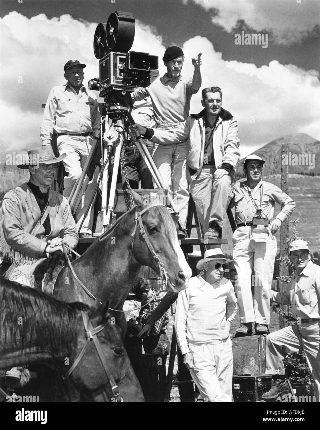 CLARK GABLE as Flint Mitchell on set location filming with camera crew including WILLIAM C. MELLOR and director William A. WELLMAN in ACROSS THE WIDE MISSOURI 1951 screenplay Talbot Jennings book Bernard DeVoto Metro Goldwyn Mayer Stock Photo