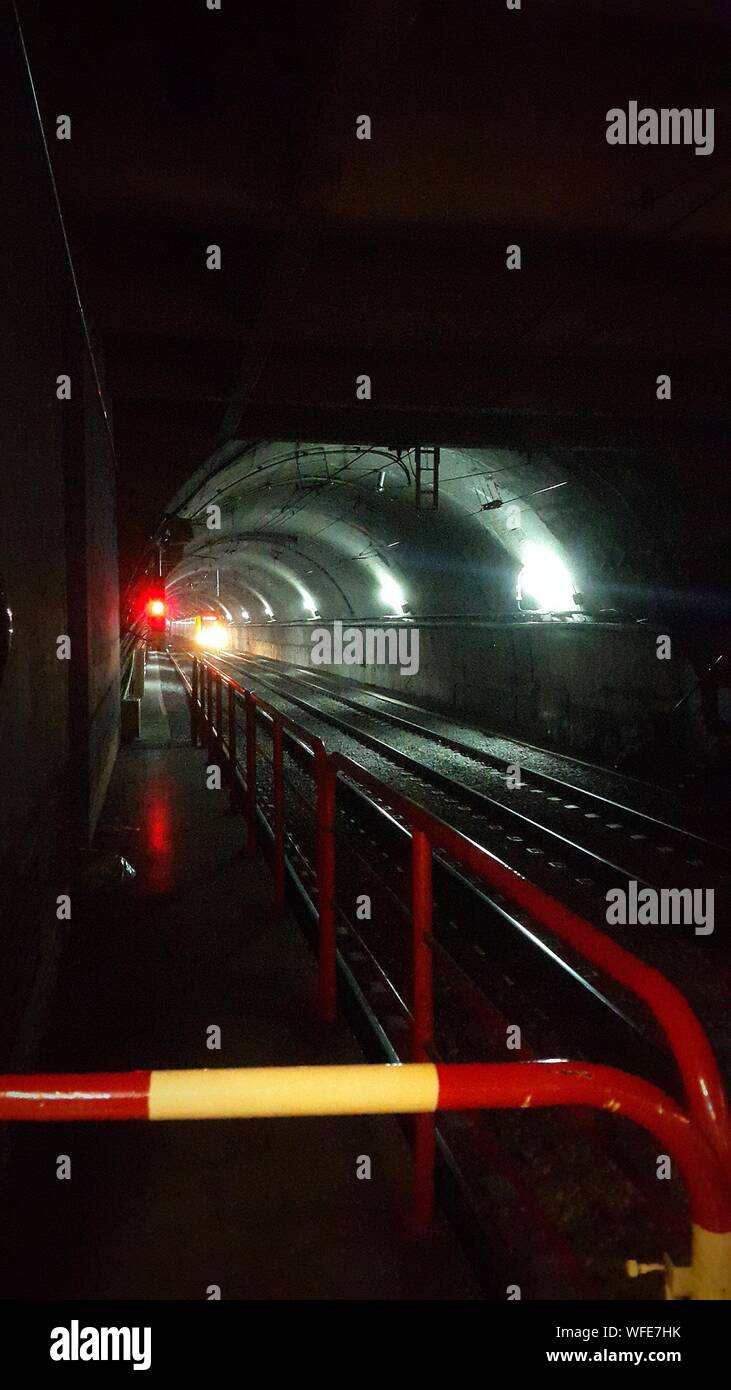 Illuminated Subway Station Tunnel Stock Photo