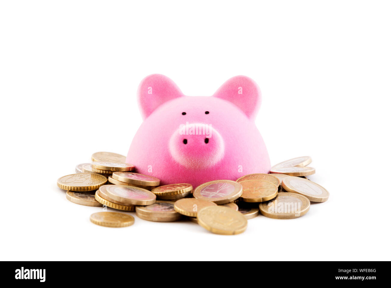 Pink piggy bank with euro coins on white background Stock Photo - Alamy