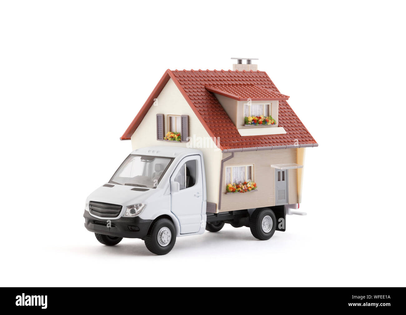 Cargo delivery truck with house on white background Stock Photo