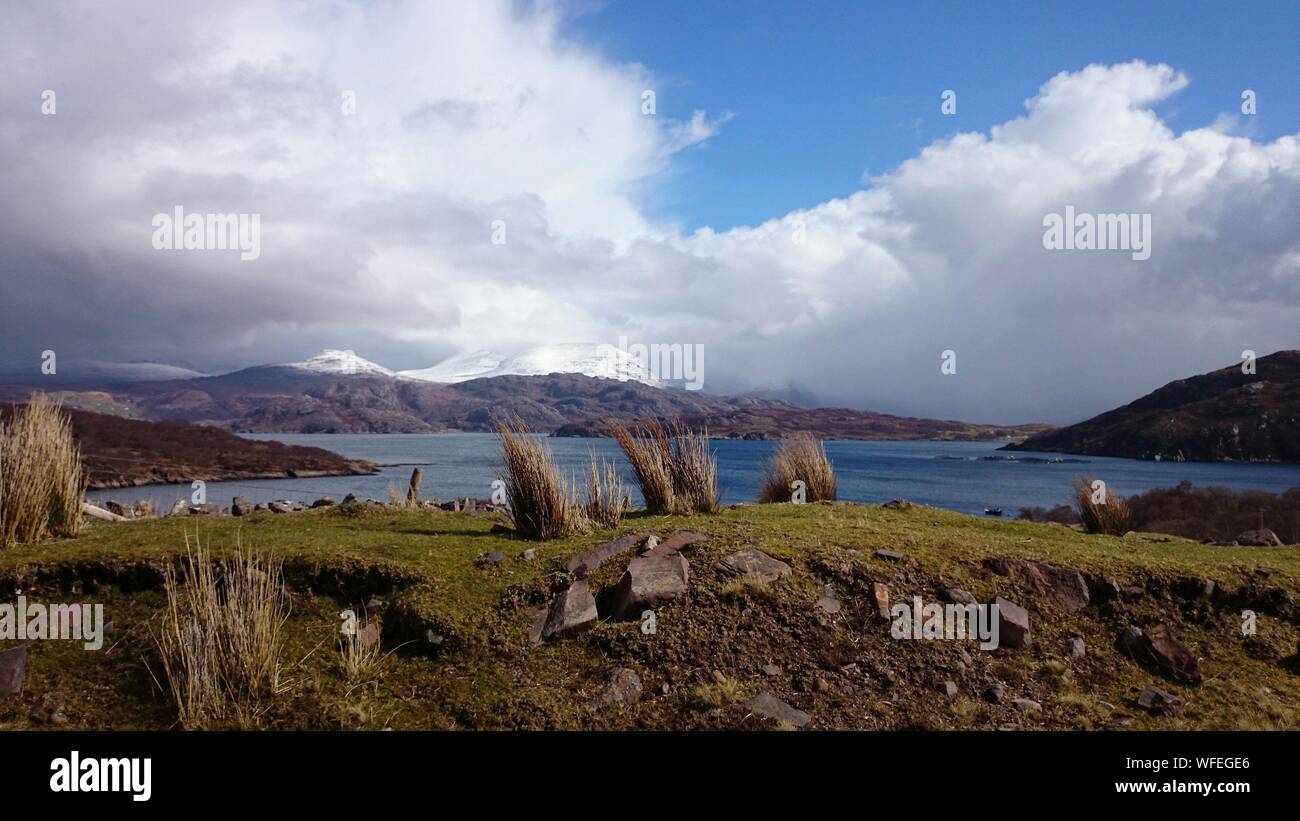 Scenic View Of Applecross Peninsula Against Cloudy Sky Stock Photo