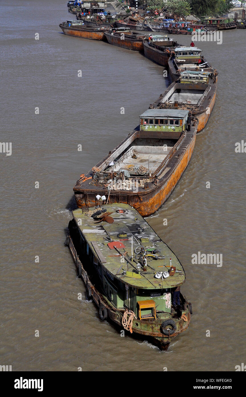 Coal barges travel on the canals leading to the Yangtze River in Nantong China Stock Photo