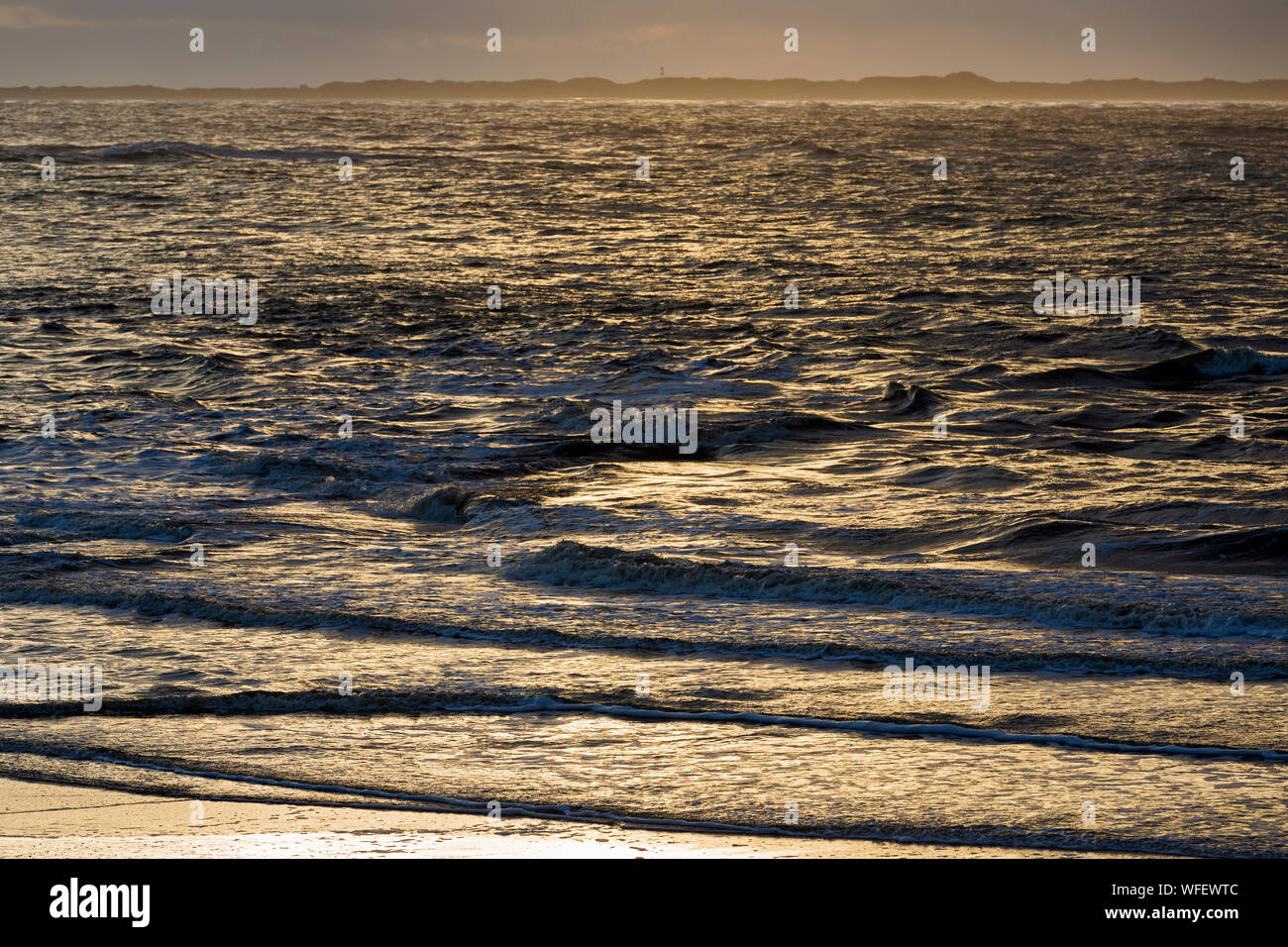 Norderney, Weststrand, Strand, Meer, Brandung, Wolken, Insel Juist, Sonnenuntergang Stock Photo