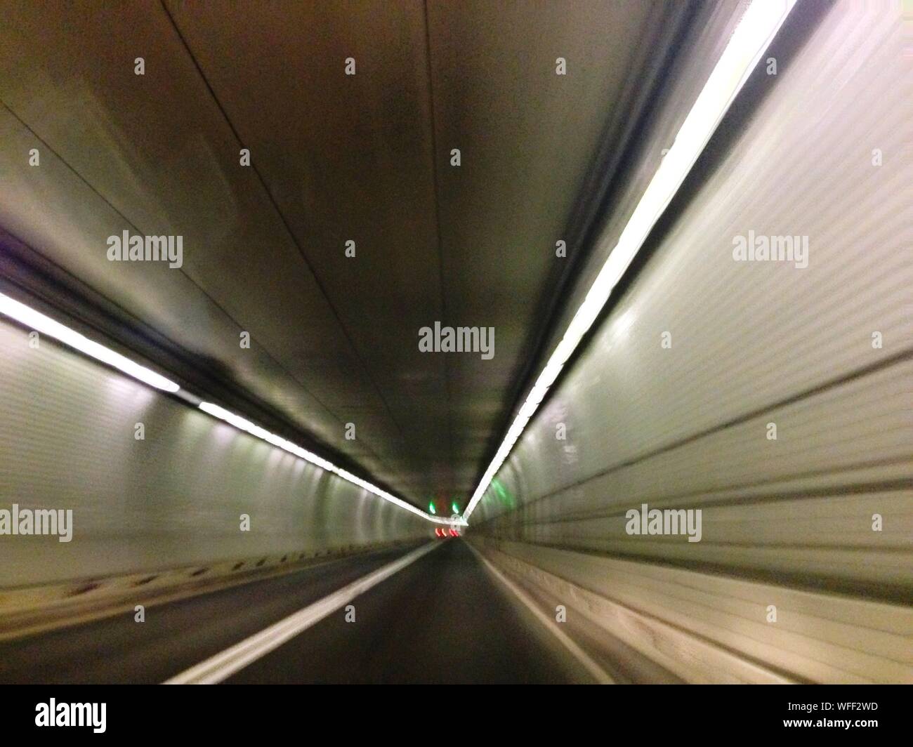 Vanishing Point Of Illuminated Tunnel Stock Photo