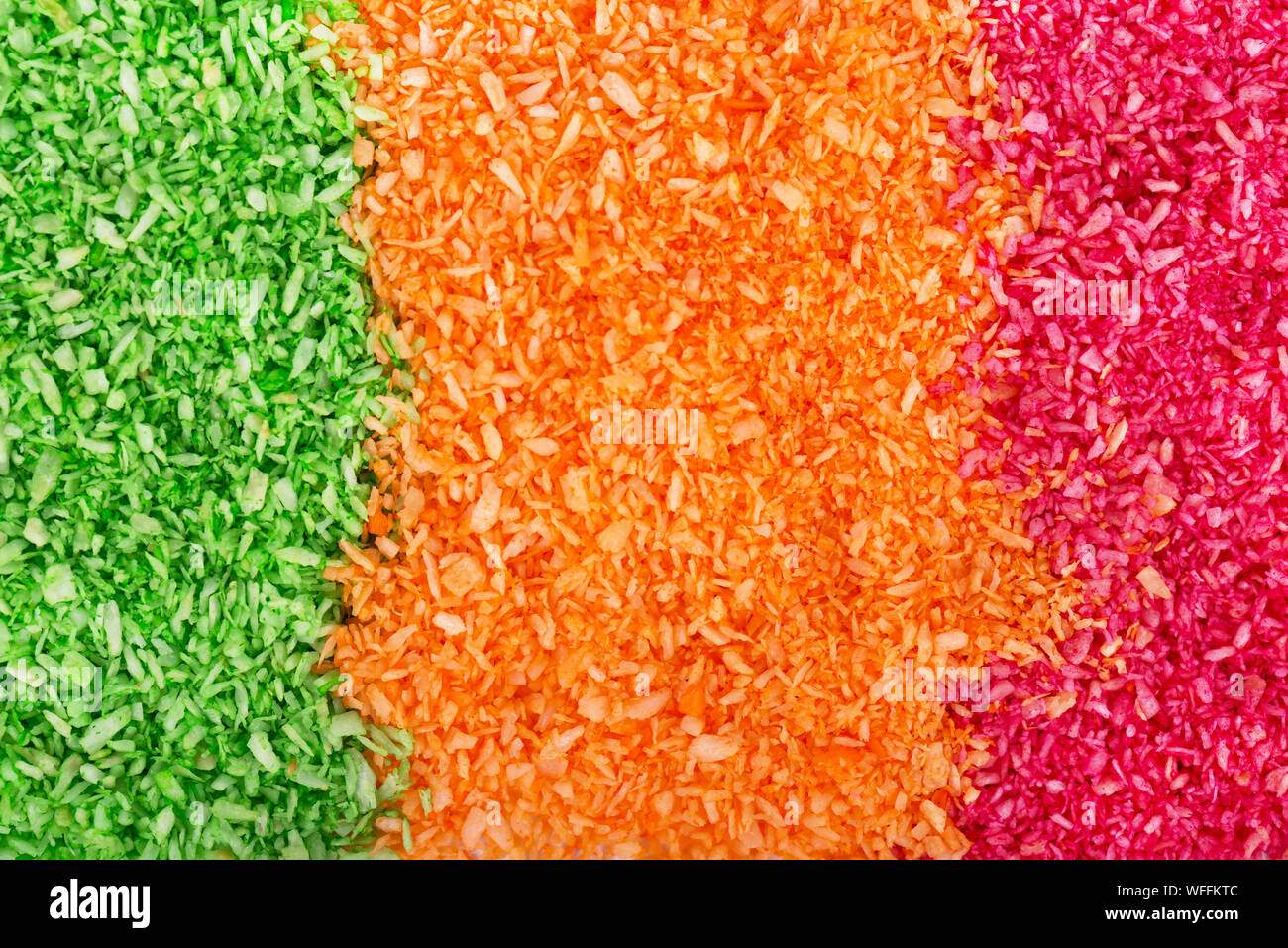 Multicolored dyed shredded coconut. Dried grated coconut Stock Photo