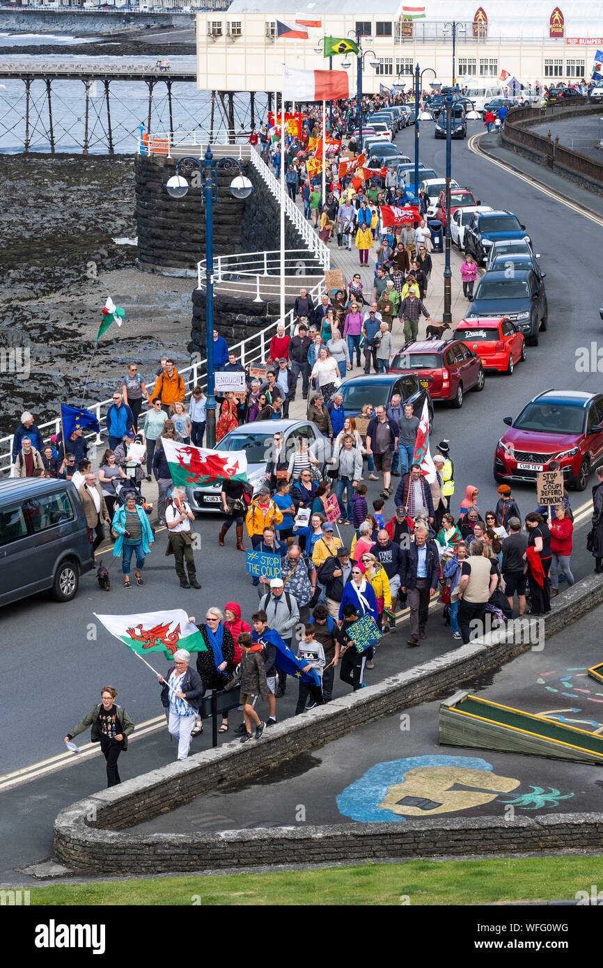 Aberystwyth Wales UK, Sat 31 August 2019.  Over 500 people march along the seafront in Aberystwyth in protest at the planned ‘anti-democratic’ 5 week prorogation of parliament in the run-up to Brexit at the end of October. Similar protest have been taking place in towns and cities across the UK The protesters were addressed by ELIN JONES, Welsh Assembly member and Speaker of the Welsh Parliament, and BEN LAKE, the local MP.  ELIN JONES announced that she would be recalling the Welsh Assembly next week to enable welsh Assembly Members to debate this issue. Photo credit: Keith Morris/Alamy Live Stock Photo