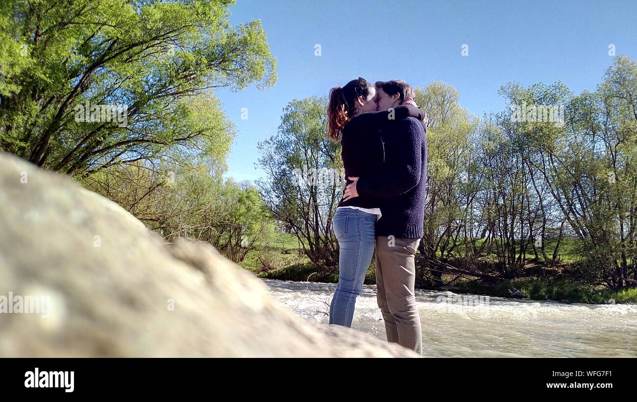 Couple Kissing Against Tree High Resolution Stock Photography and ...