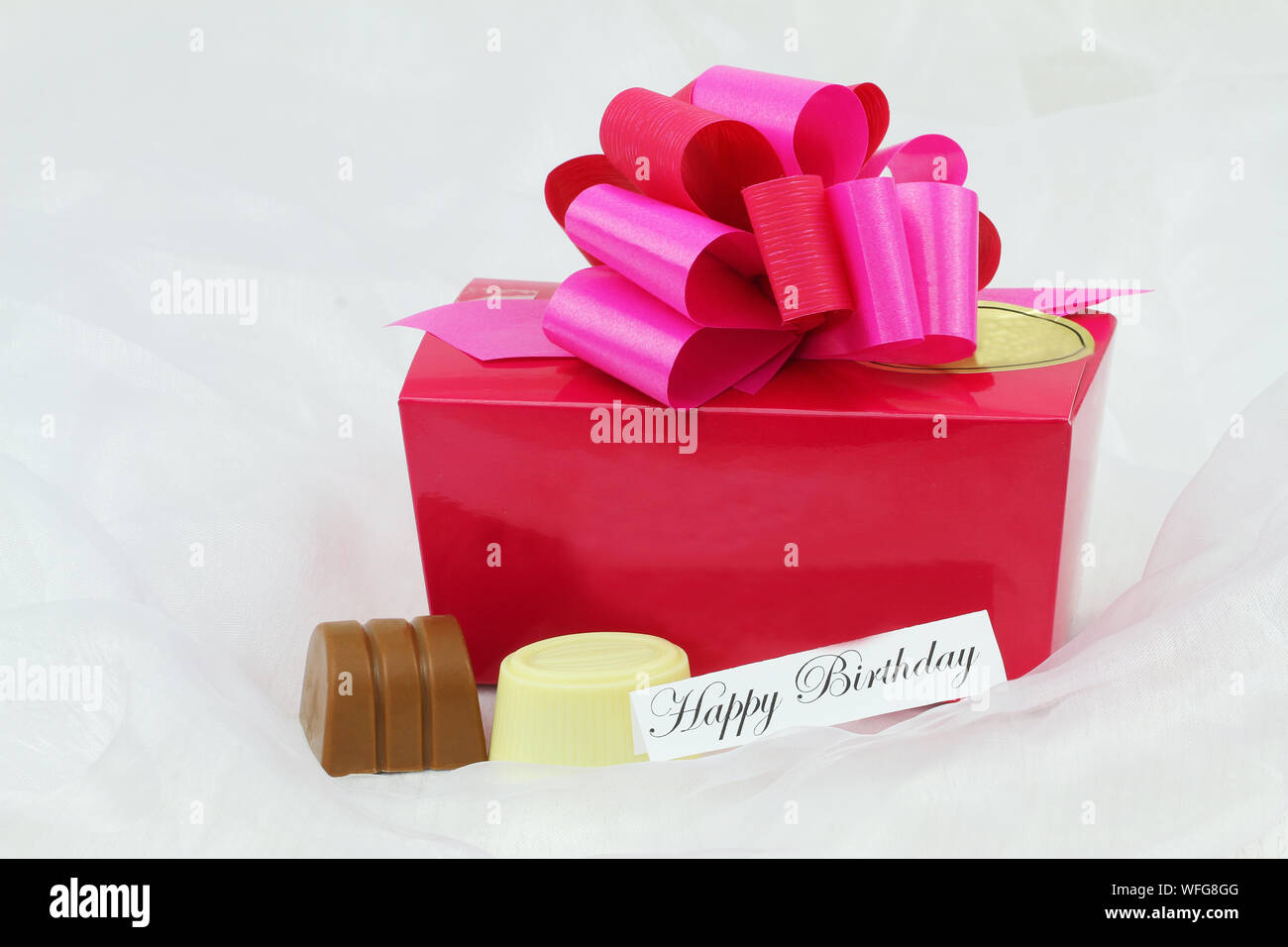 Close up of pink and red ribbon tied around box of luxury white chocolates  Stock Photo - Alamy