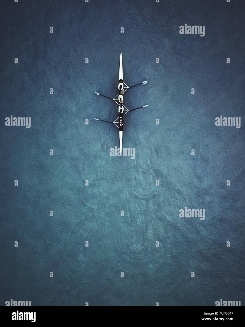 Aerial View Of People Rowing Boat At Sea Stock Photo Alamy