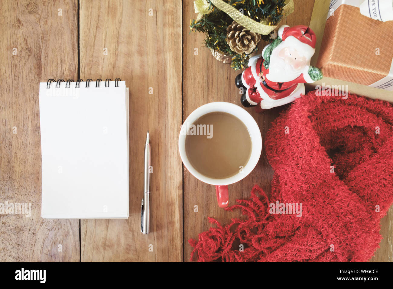 Directly Above Shot Of Coffee With Spiral Notebook And Christmas