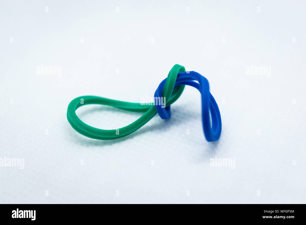 Green and Blue Rubber bands Connected Stock Photo Alamy