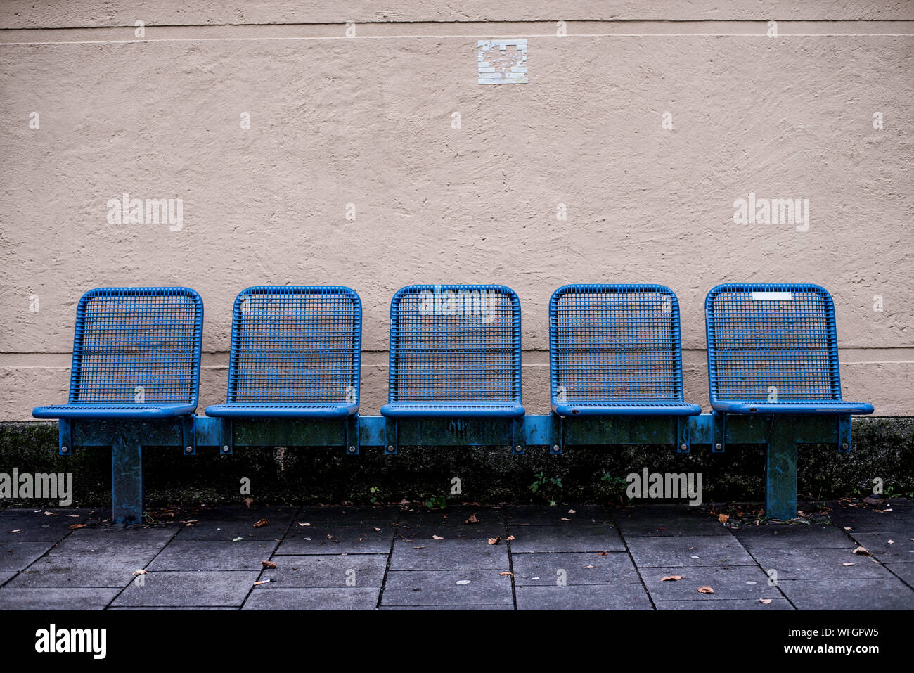 Metallic Blue Chairs Against Wall Stock Photo Alamy