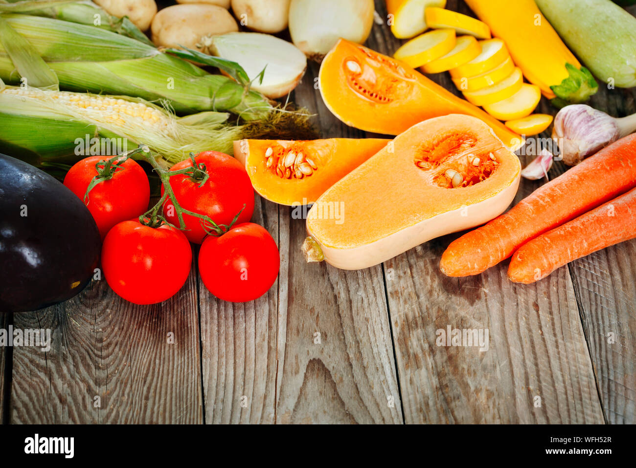 Arrangement of various fruit and vegetables on a wooden table Stock Photo