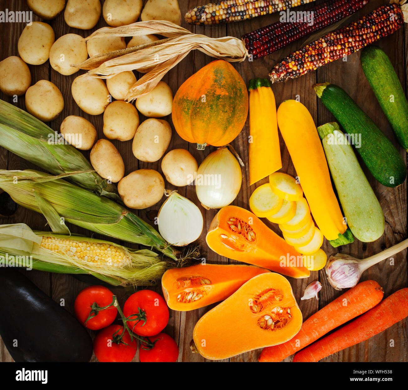 Arrangement of various fruit and vegetables on a wooden table Stock Photo