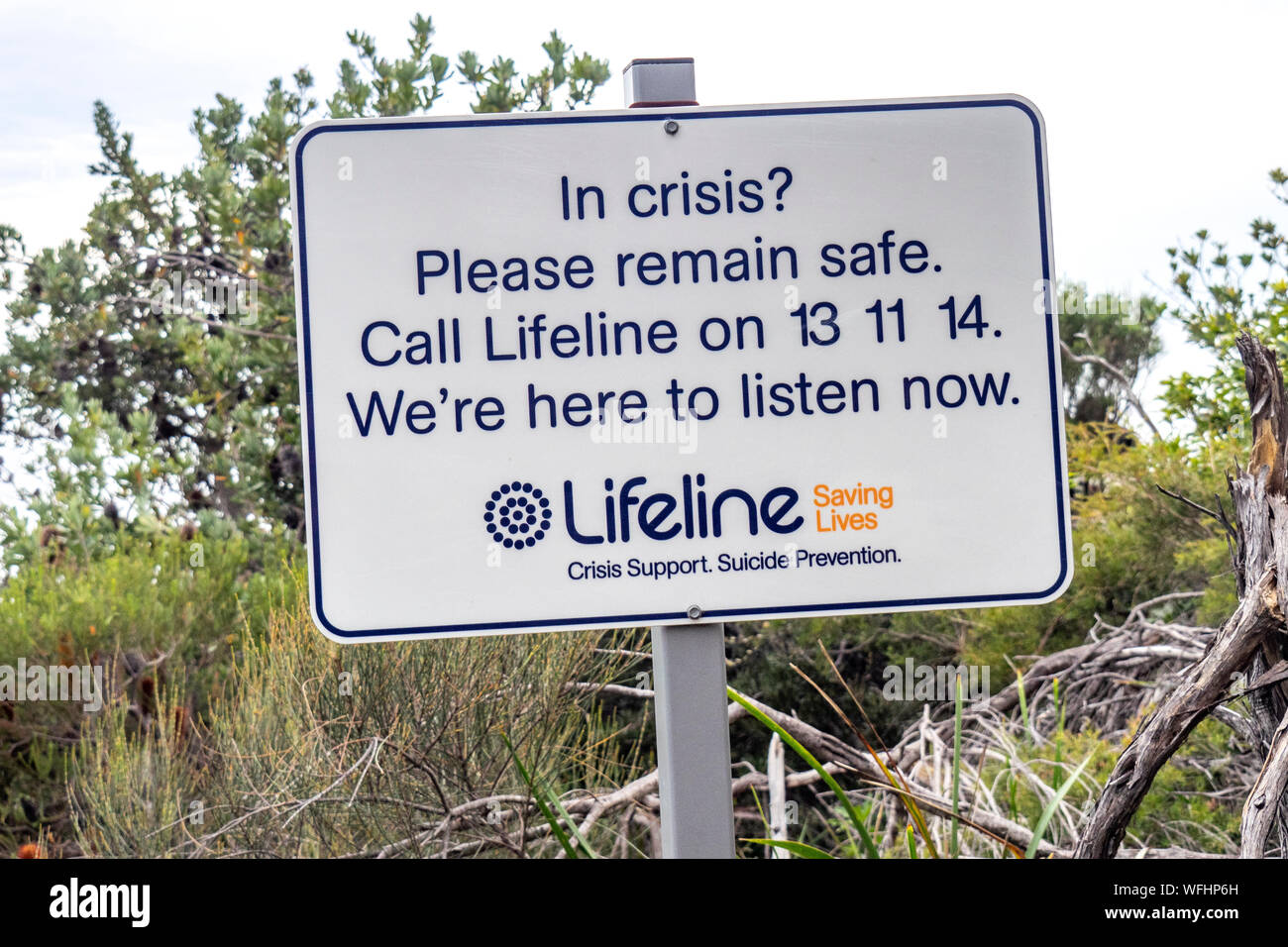 Lifeline suicide prevention sign near a cliff at Manly Headland, Sydney, NSW Australia. Stock Photo