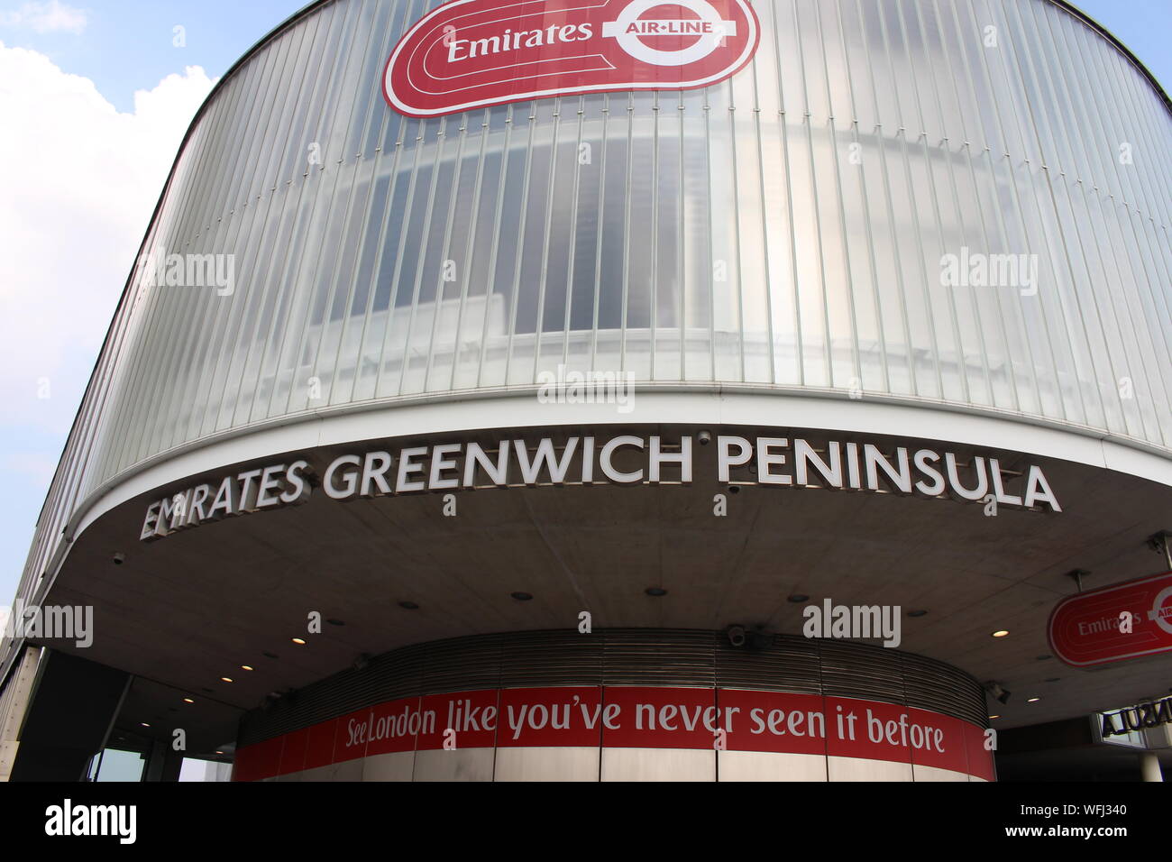 A photograph of the Terminal building for the Emirates cable car across the Thames.  Emirates Greenwich Peninsula signage. Stock Photo