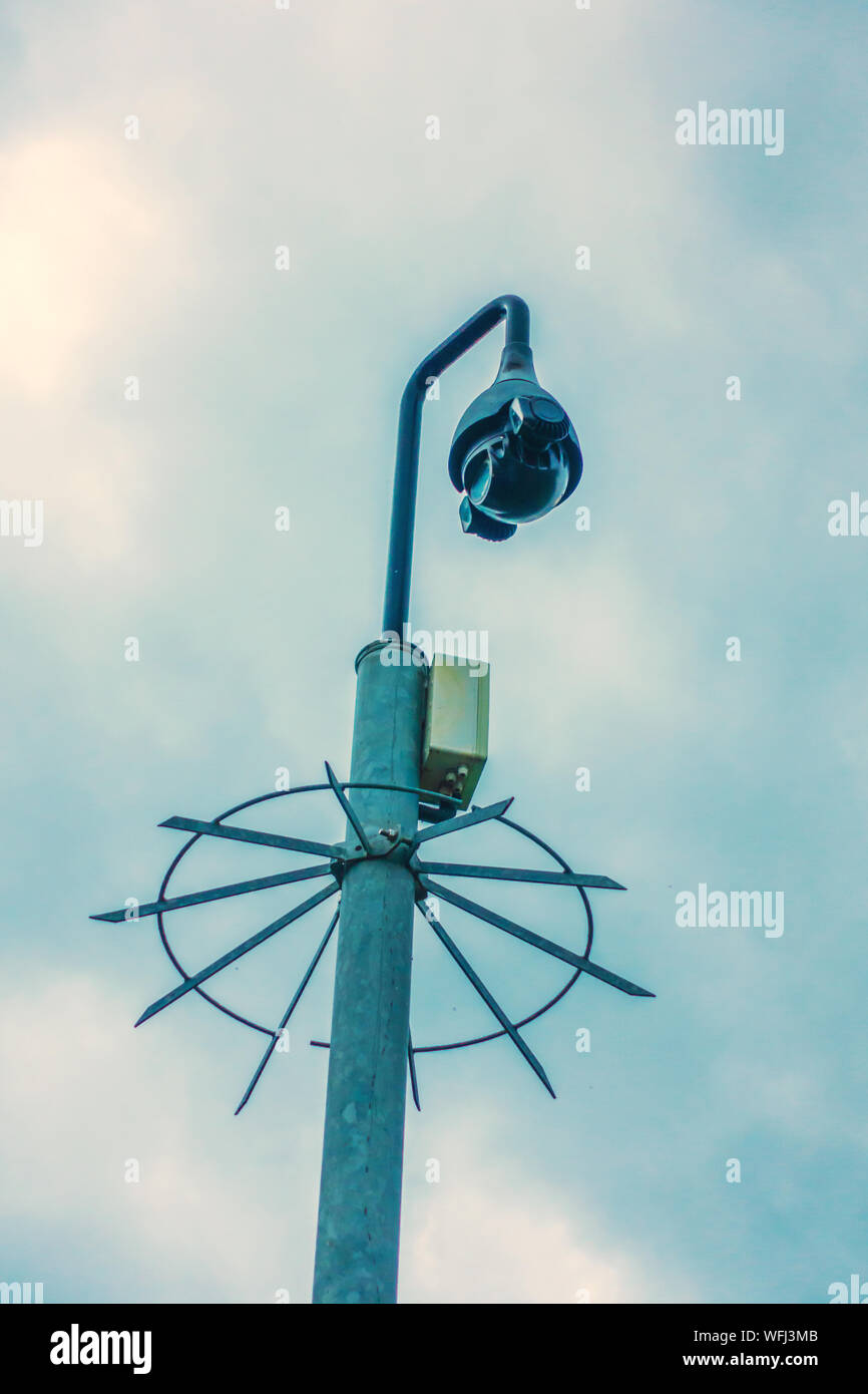 CCTV camera with spiked protection ring Stock Photo