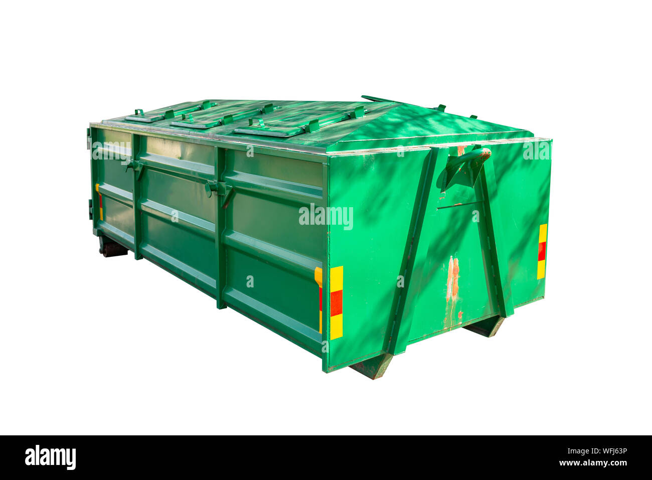 A large, metal, green garbage container and municipal waste, isolated on white background with clipping path. Stock Photo