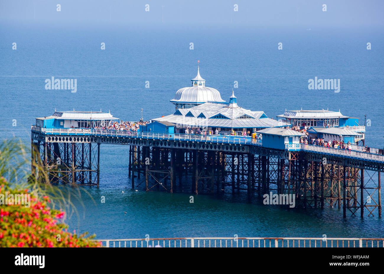 The Victorian pier complex in the Irish sea  at the North Wales seaside holiday resort of Llandudno Stock Photo