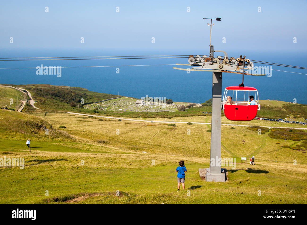 The colourful Llandudno Cable Car as it passes over the Great Orme