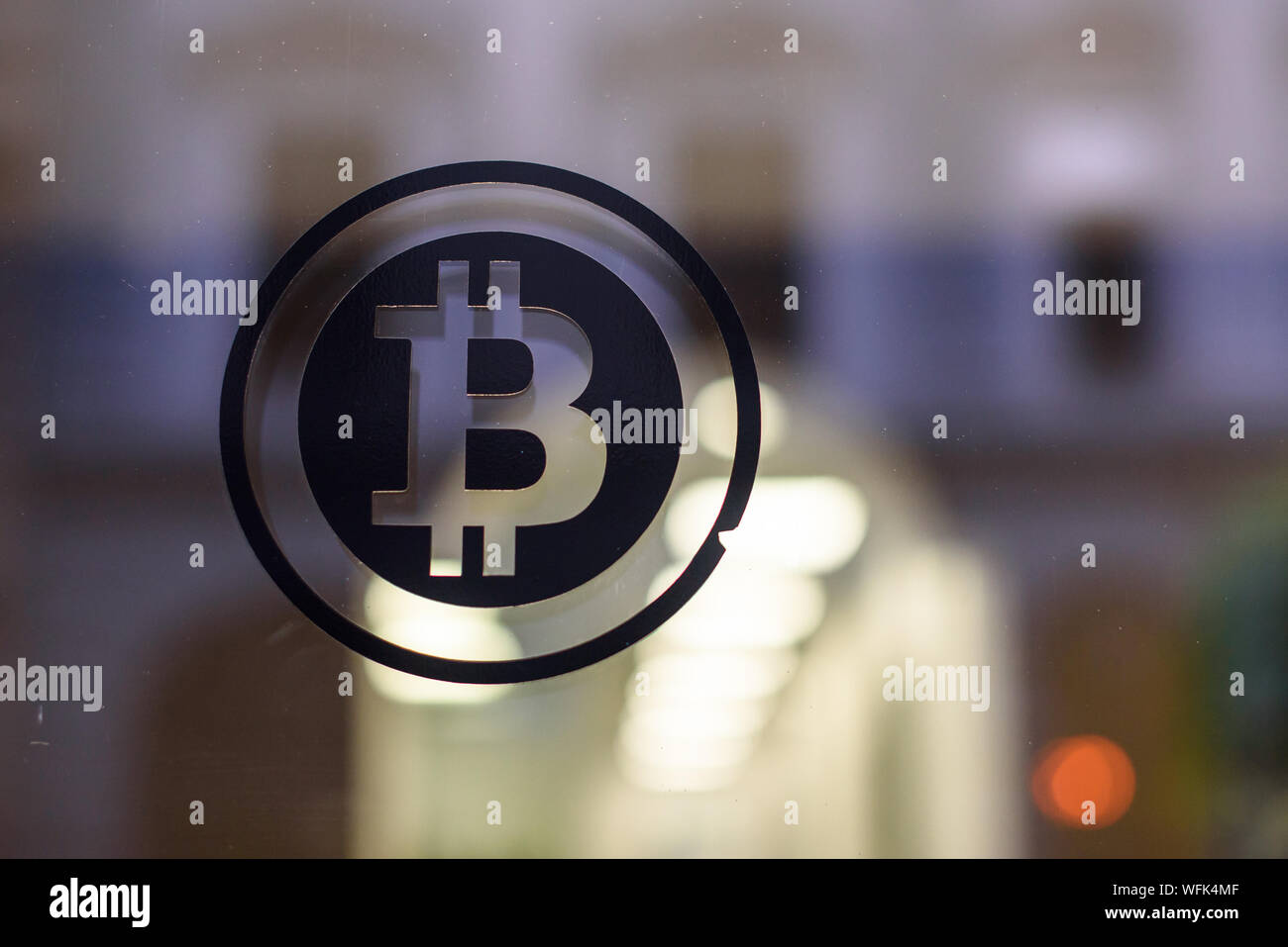 RIGA, LATVIA. 29th August 2019. Bitcoin logo on window. Bitcoin is a  cryptocurrency. It is a decentralized digital currency without a central  bank or single administrator Stock Photo - Alamy
