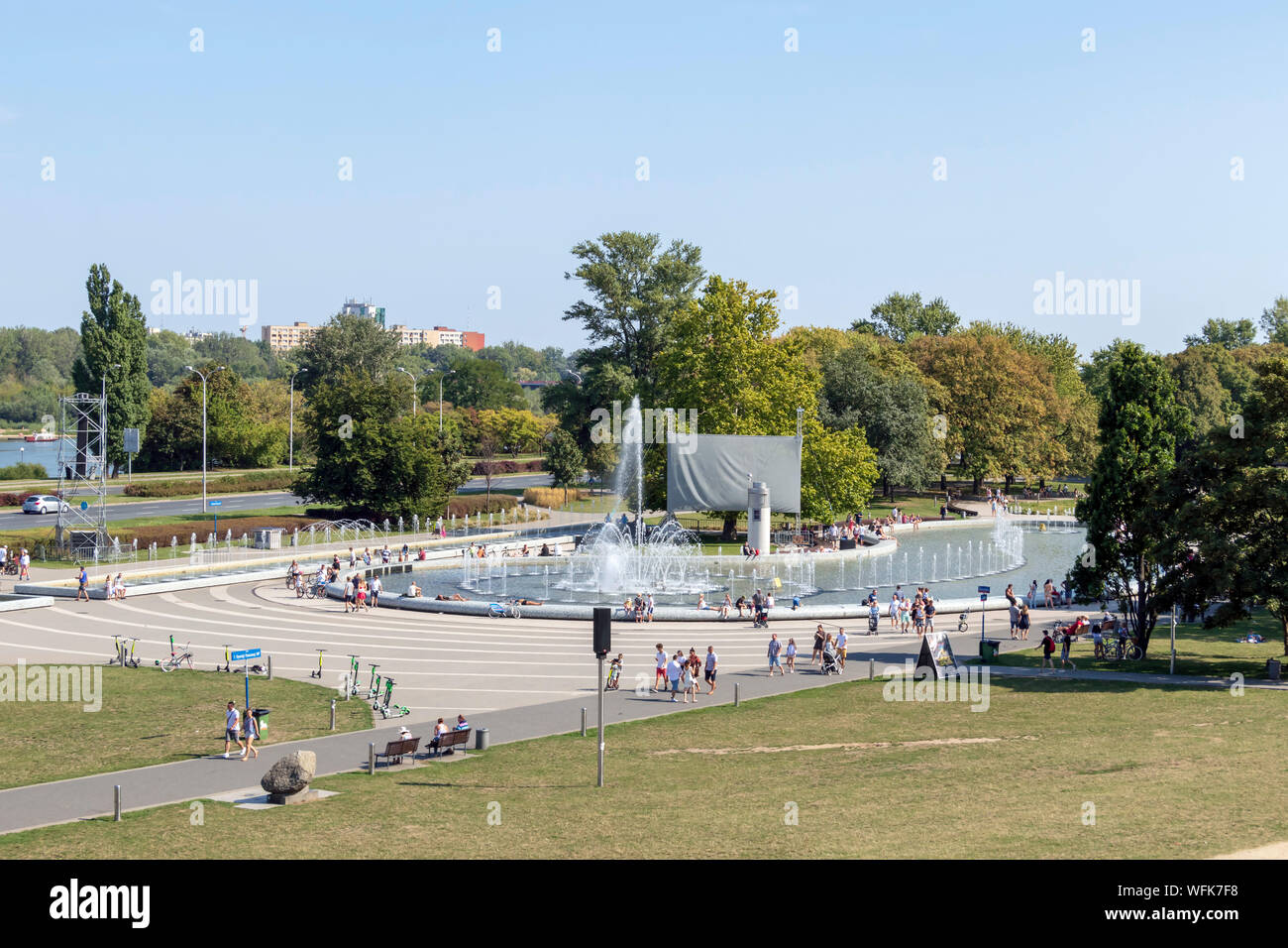 Warsaw, Poland – August, 2019 : People resting in Multimedia Fountain Park in summer sunny day Stock Photo