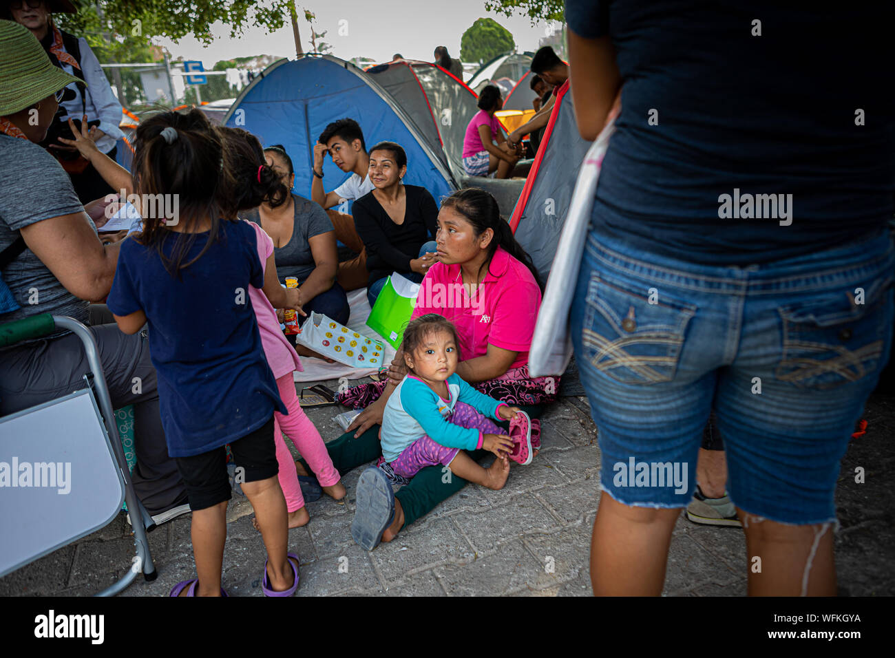Matamoros, Mexico. 24th Aug, 2019. Immigration lawyers working with the Atlanta-based group Lawyers for Good Government, attempted to inform hundreds of asylum seekers of their legal rights after they had been sent back to Matamoros, as part of the Trump's 'Remain in Mexico' program. (Photo by Rana Sajid Hussain/Pacific Press) Credit: Pacific Press Agency/Alamy Live News Stock Photo