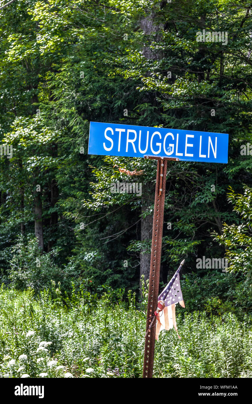 COUDERSPORT, PA, USA-10 AUGUST 18: A street sign on a rural road named 'Struggle Lane'. Stock Photo