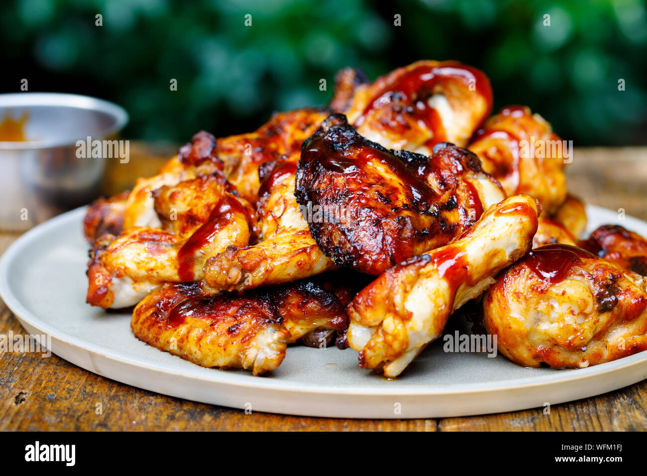 Barbecue chicken wings and drumsticks with sauce Stock Photo