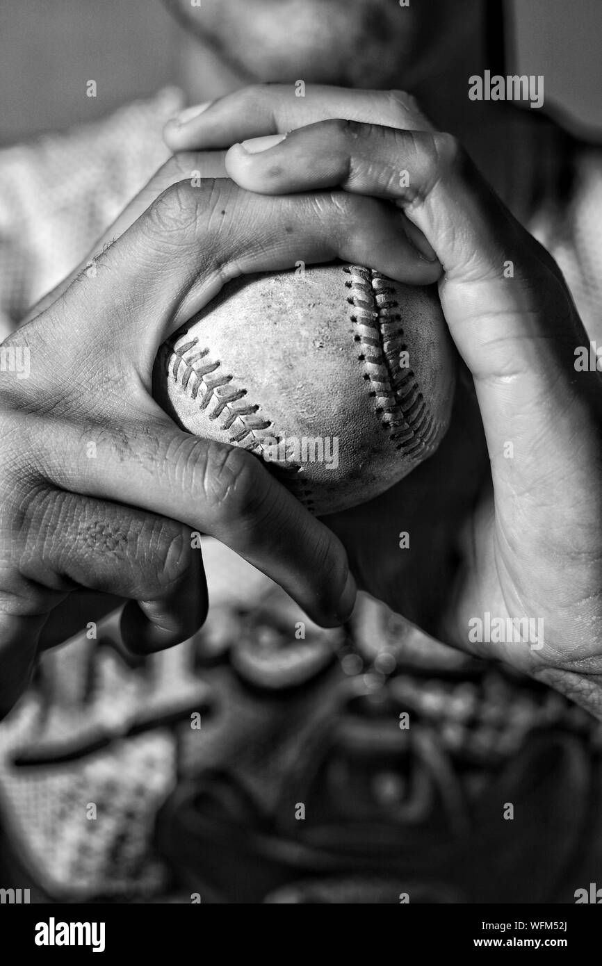 Hand holding baseball Black and White Stock Photos & Images - Alamy