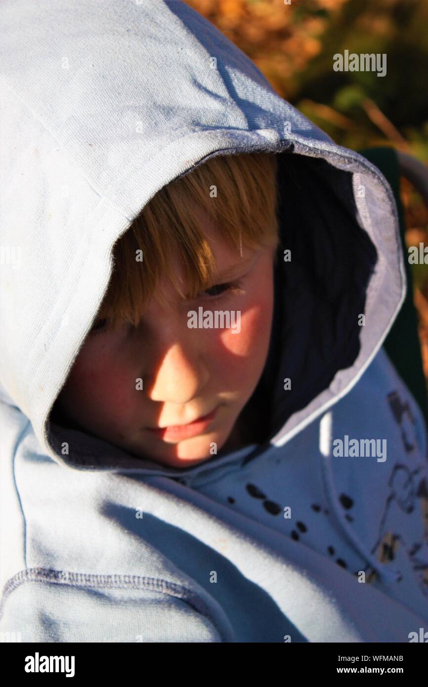 Close-up Of Boy In Hood Clothing Stock Photo