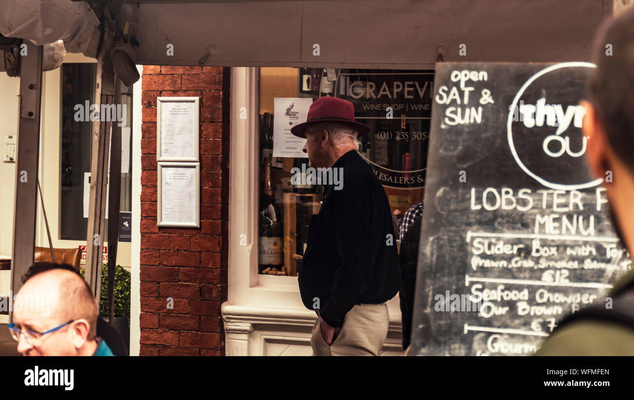 Outside menu and visitors of street restaurant. Dalkey, Dublin, Ireland.25 August 2019. Seafood