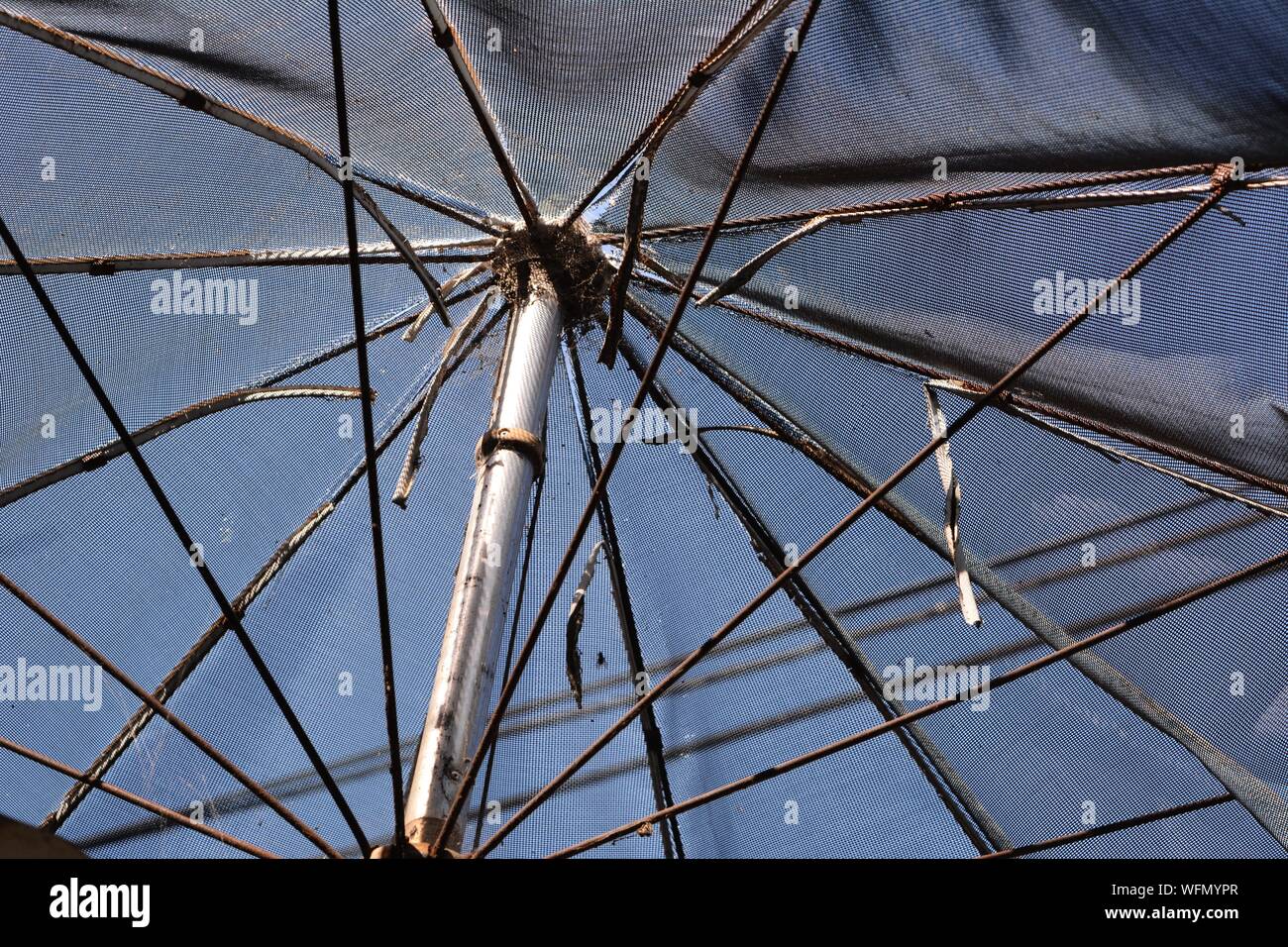 Broken parasol hi-res stock photography and images - Alamy