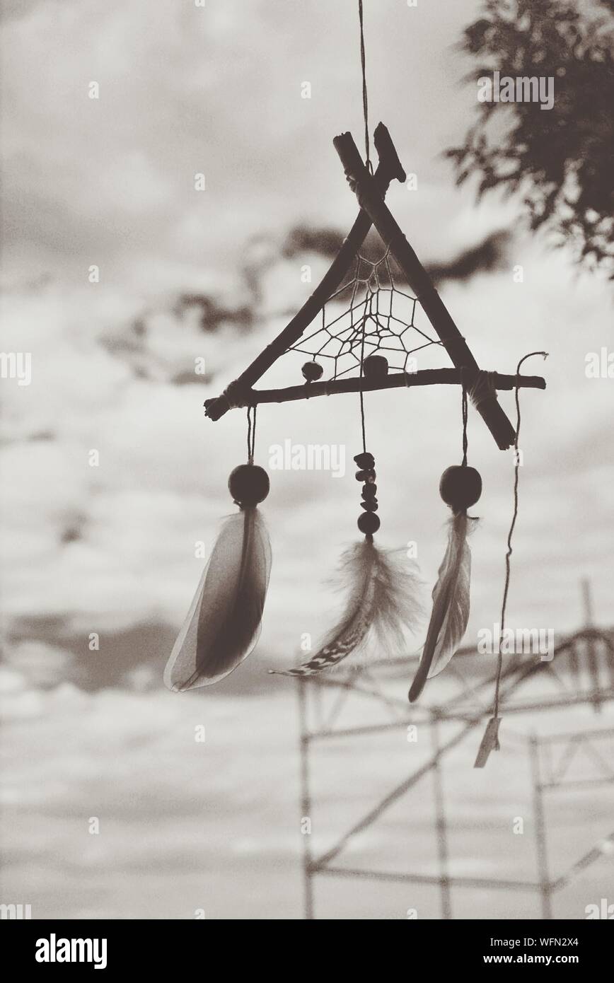 Close-up Of Wind Chimes Against The Sky Stock Photo
