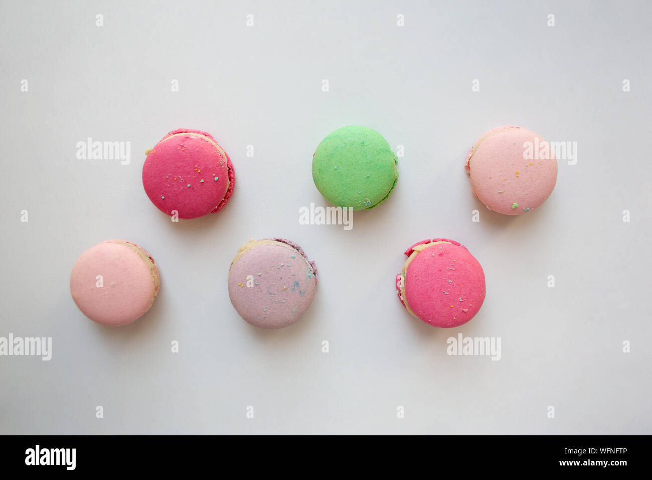 Pastel colored macaroons isolated on white background from a high angle view Stock Photo