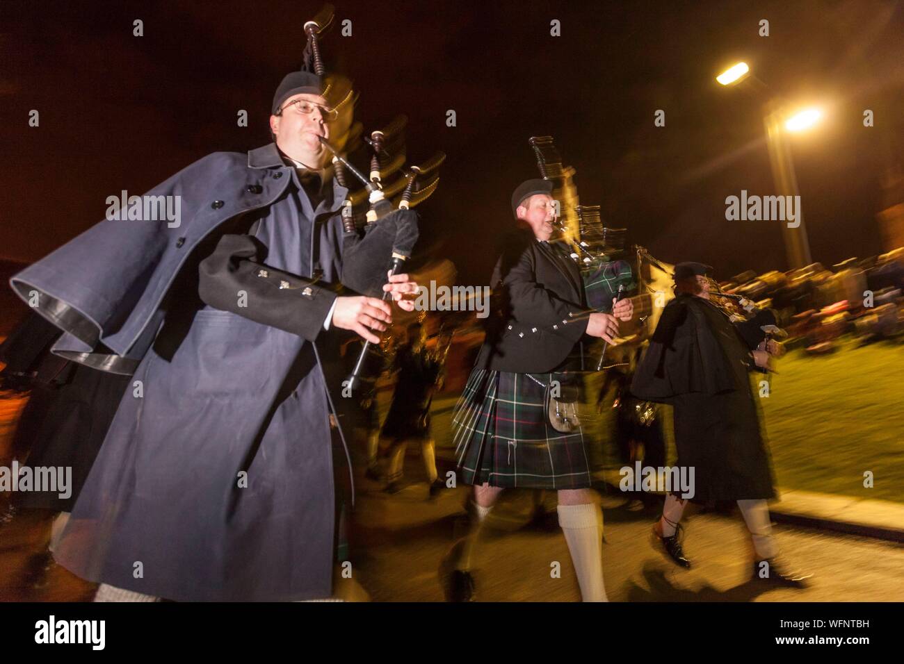 United Kingdom, Scotland, Shetland Islands, Mainland, Lerwick, Up Helly Aa festival, bagpipers parading to the site where the viking longship will be set on fire Stock Photo