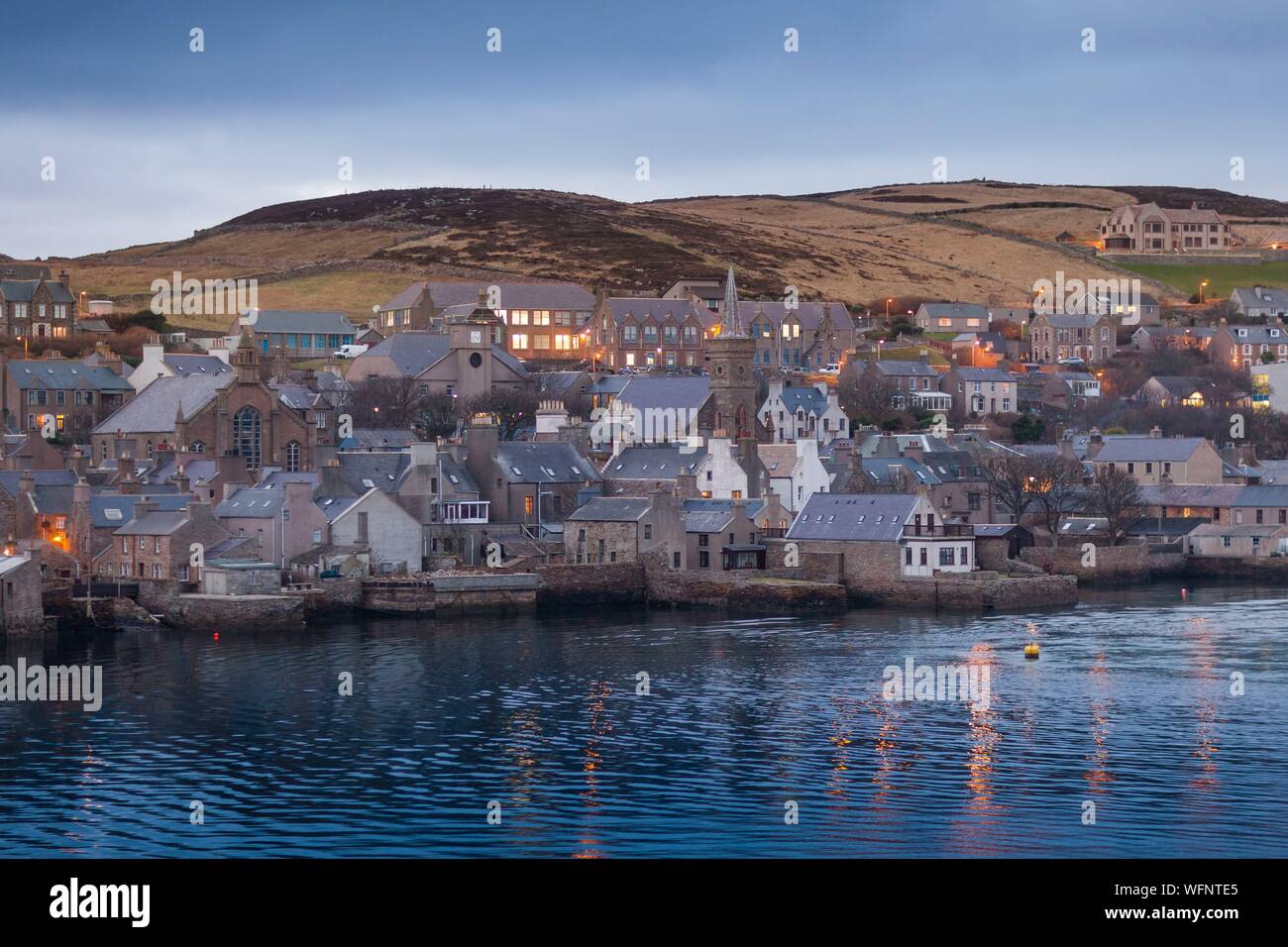 United Kingdom, Scotland, Orkney Islands, Mainland, Stromness, harbour at night, seen from departing ferry Stock Photo